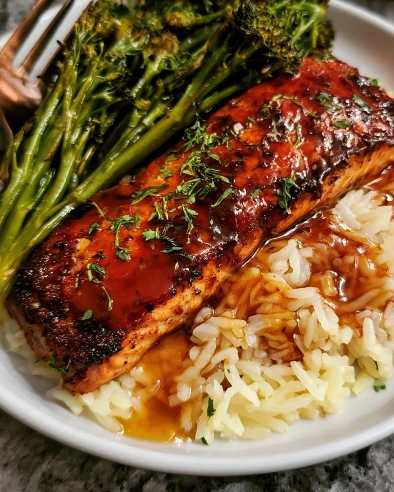 Delicious honey glazed salmon served with rice and broccoli on a plate