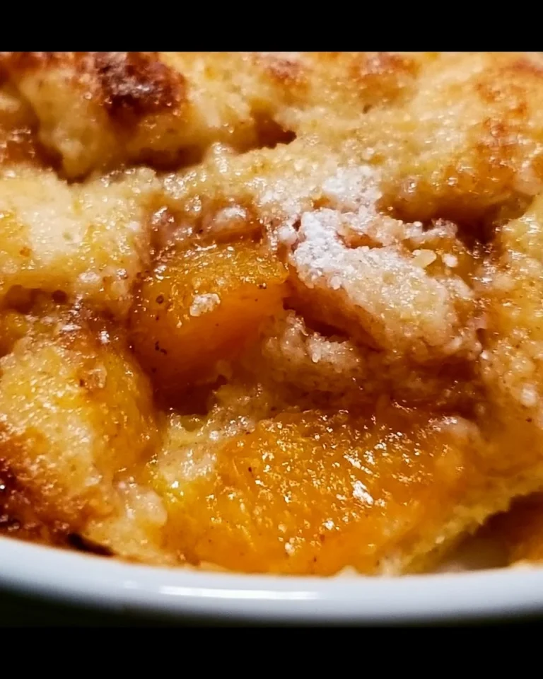 Delicious Southern peach cobbler served warm with a golden crust and juicy peach filling