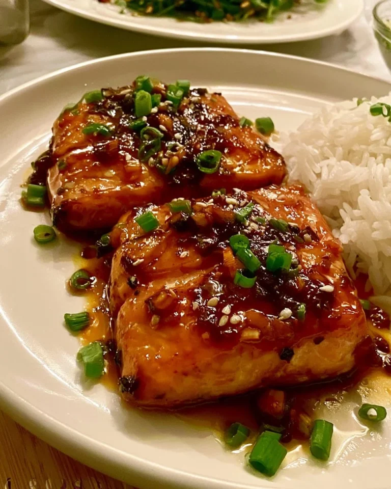 Delicious Honey Garlic Salmon fillet garnished with herbs on a plate