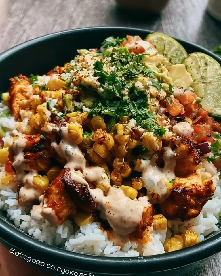 Delicious Street Corn Chicken Bowl served over rice with fresh toppings.